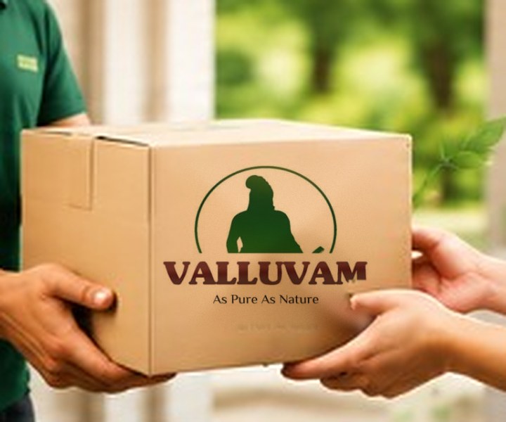 Delivery person handing a Valluvam box to a customer